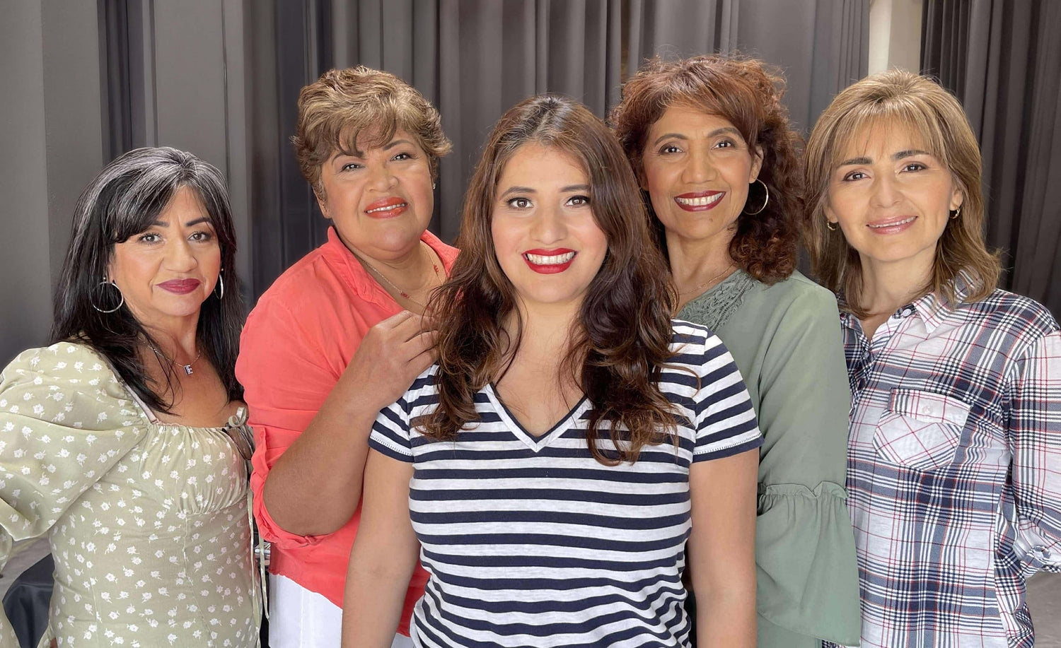 Students smiling at the camera after completing their Beauty Makeup Experience, showcasing their self-applied makeup.